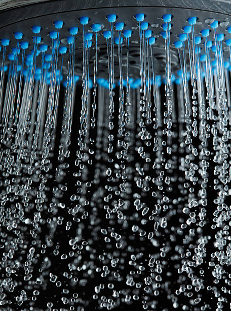 istock Shower with running water over black background 511798982