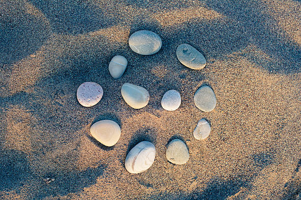 pebbles on the sand stock photo