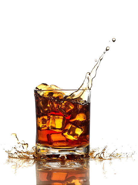 istock Glass of whiskey, ice cubes. 511801422