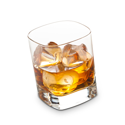 Whisky with ice cubes isolated on white background.
