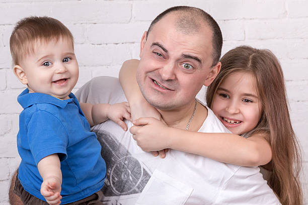 istock Tortured dad with kids on his hands 511803096
