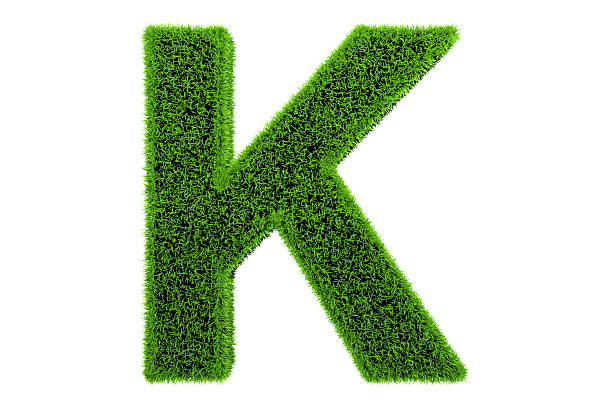 gras das alphabet buchstabe k - letter k alphabet three dimensional shape green stock-fotos und bilder