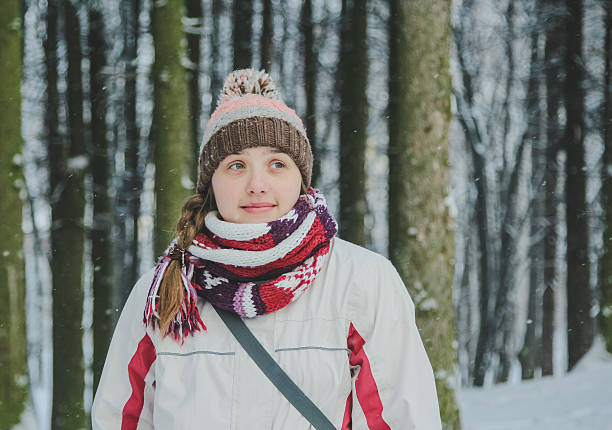 istock Pensive girl in winter park 511804354