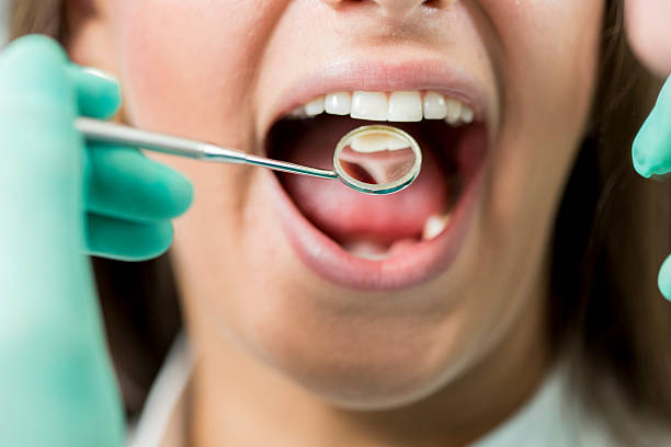 istock Young woman at the dentist 511804821