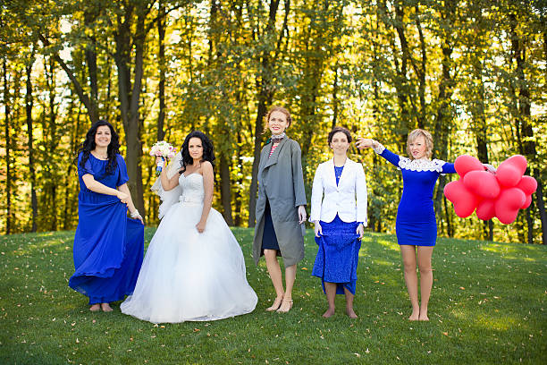 istock Bride with her friends dancing in the meadow 511805088