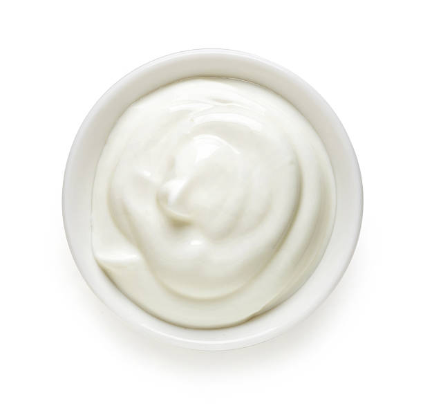 istock White bowl of cream, top view 511805336