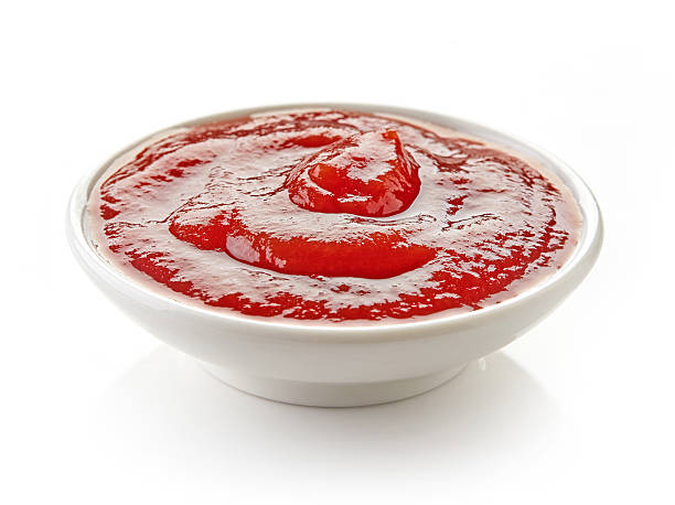 istock Ketchup or tomato sauce on white background 511805600