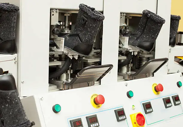 Photo of Gray winterized boots in manufacturing process