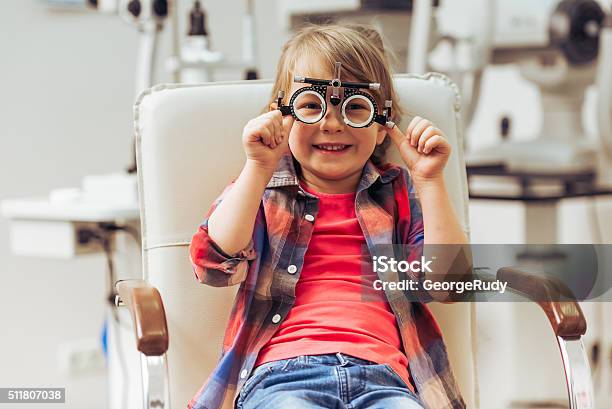 At The Ophthalmologist Stock Photo - Download Image Now - Optometrist, Child, Optometry