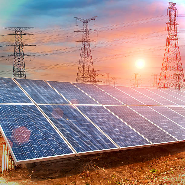 istock Power plant using renewable solar energy and Electric power towe 511807167