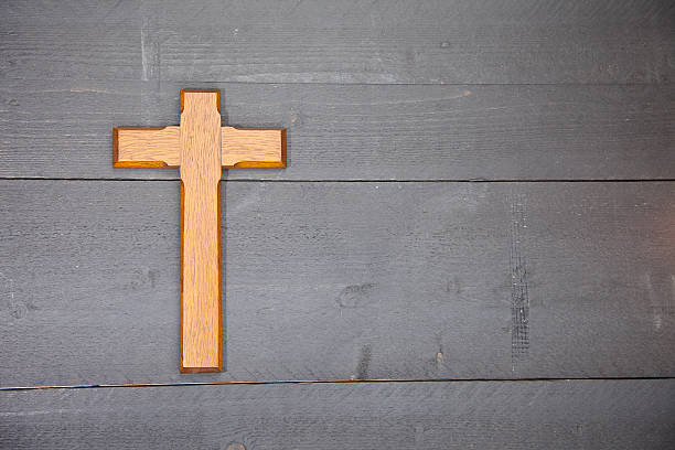 istock Wooden easter cross on black wooden background 511807322