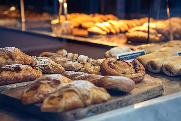 Close up of various pastries in a Cornish bakery window