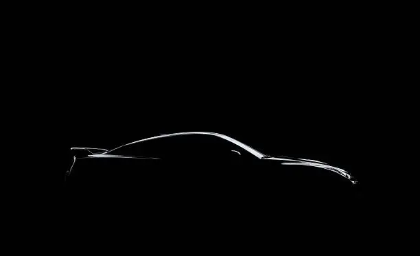 Photo of Silhouetted Car on Black
