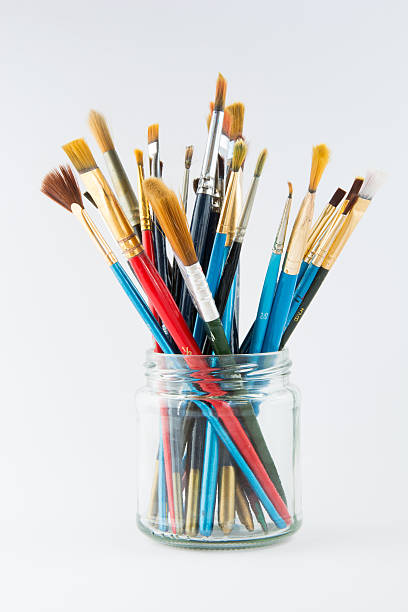 istock Artist paint brushes in a glass jar 511808122