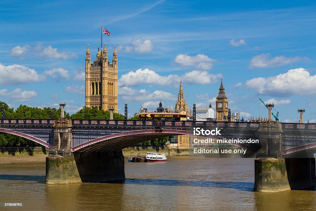 Lambeth Bridge, Westminster and Tour Bus in the Summer London, UK - July 18, 2015: Lambeth Bridge in London during the summer. The River Thames, Westminster and a Big Bus Tour Bus can be seen. Architecture Stock Photo