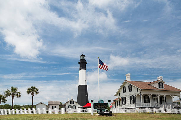 American Flag and Tybee Lighthouse stock photo