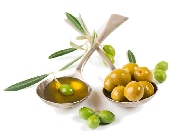 istock olive oil and green olives 511808279