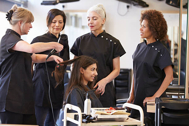 istock Teacher Training Mature Students In Hairdressing 511808587