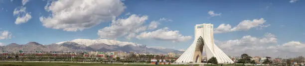 Huge Panorama of the Azadi Tower or The Freedom Tower of Tehran, and Milad tower in the distance, with the Alborz mountain range even further back, Tehran, Iran