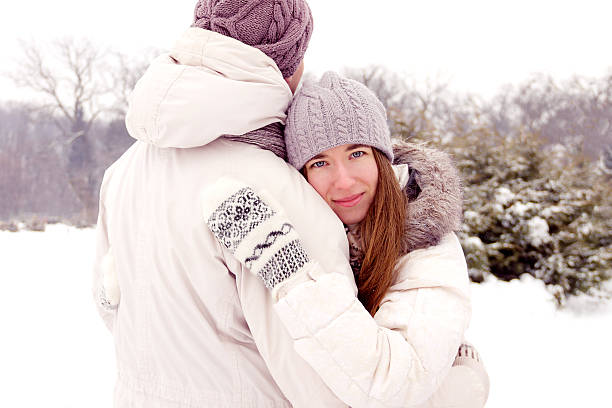 istock Happy couple doing selfie in park in winter 511809866