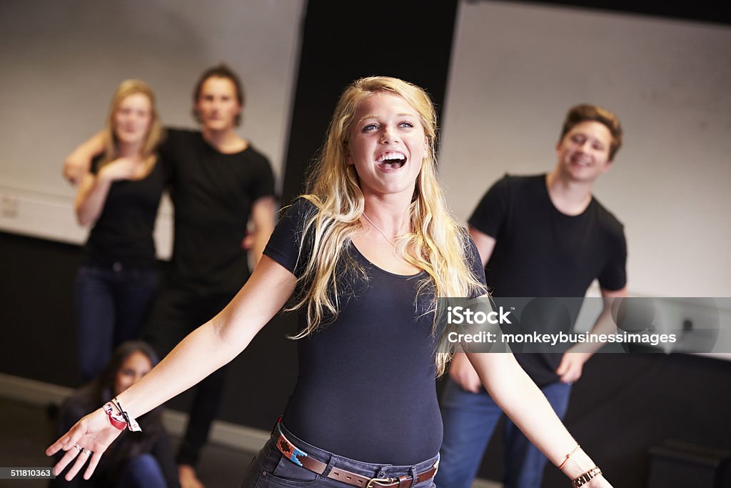 Students Taking Singing Class At Drama College Students Taking Singing Class At Drama College. Student Singing Theatrical Performance Stock Photo