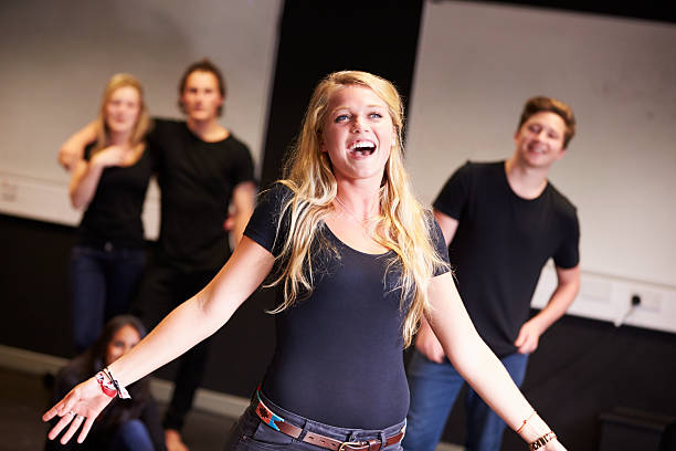 Students Taking Singing Class At Drama College Students Taking Singing Class At Drama College. Student Singing performing arts event stock pictures, royalty-free photos & images
