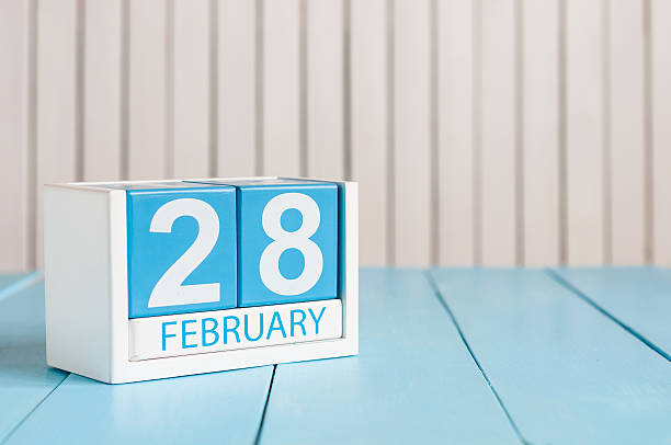 istock February 28th. Cube calendar for february 28 on wooden surface 511810440