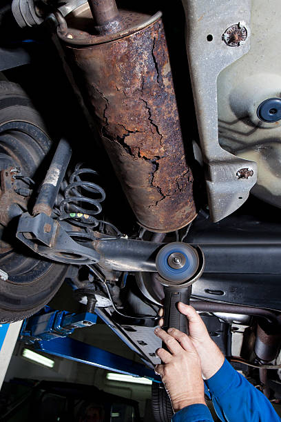 istock Auto repair shop - low-angle view, exhaust system 511810653