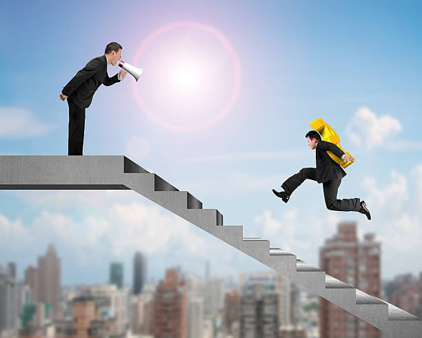 istock Businessman carrying USD with boss holding speaker yelling on st 511812230
