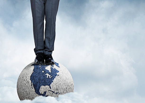 istock Man Standing On Top Of The World 511812978