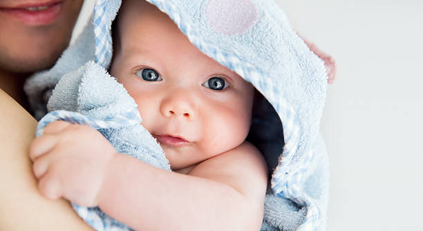 Cutest baby child after bath Cutest baby child after bath with towel on head body care shower stock pictures, royalty-free photos & images