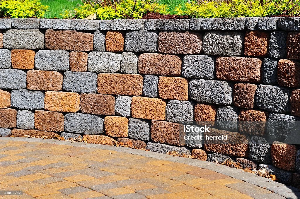 Retaining wall and patio Retaining Wall and Patio with Landscaping and Pavers Retaining Wall Stock Photo