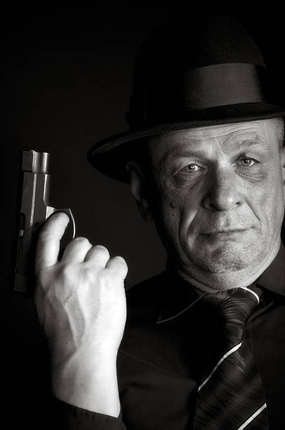 istock Senior Man holding a Gun 511845143