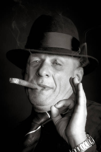 istock Handsome Senior Man Smoking a Cigar and showing OK sign 511845147