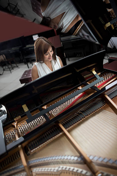Beautiful woman playing the piano