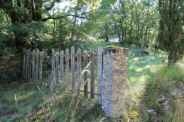 istock Wooden fence with a stone pillar 511847991