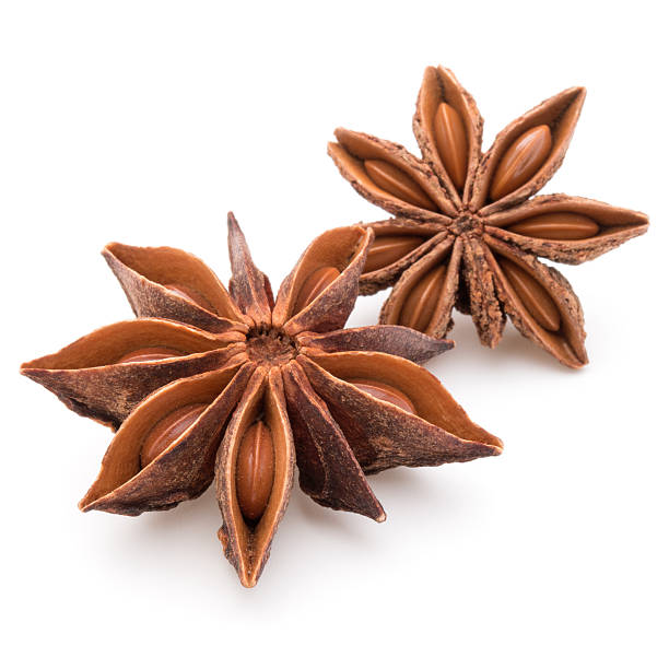 Star anise spice fruits and seeds isolated on white background Star anise spice fruits and seeds isolated on white background closeup anise stock pictures, royalty-free photos & images