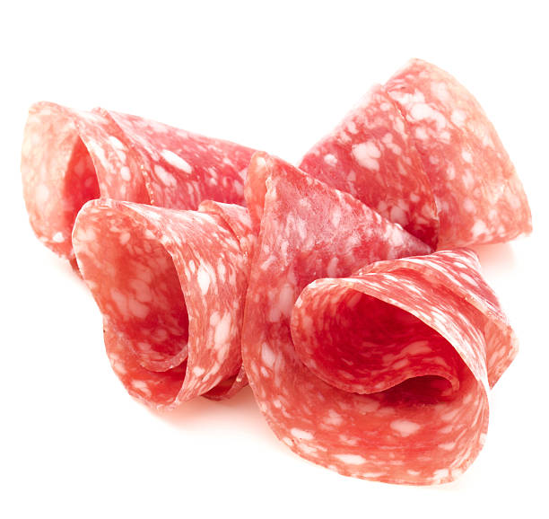 istock Salami sausage slices isolated on white background cutout 511850314