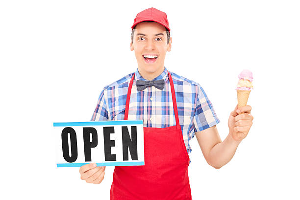 istock Excited ice cream vendor holding an open sign 511850831