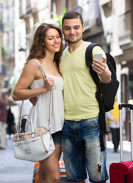 istock Couple doing selfie at the street 511851919