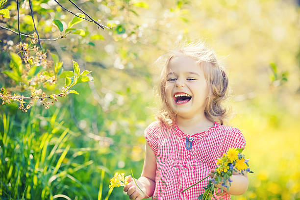 istock Happy little girl in spring sunny park 511852788