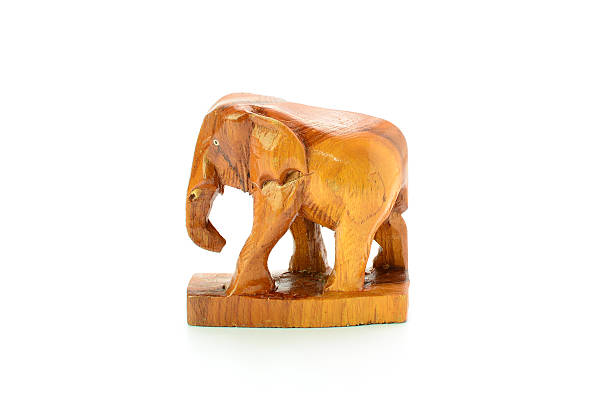 istock Hand-carving of an elephant ion front of a white background 511853484