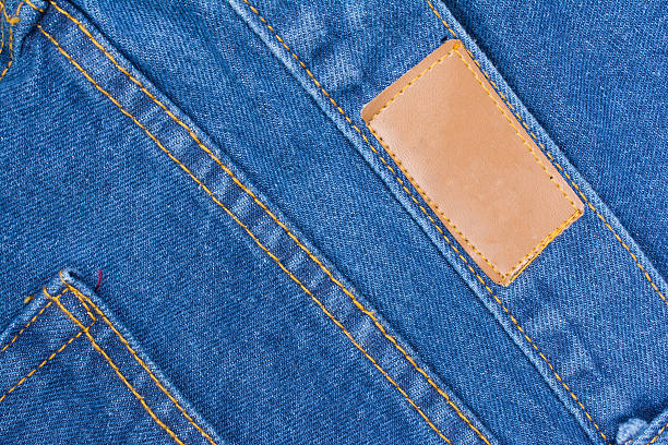istock Back of blue jeans with leather label 511855642