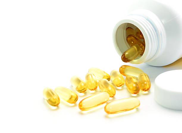istock fish oil capsule isolated on white background 511857586