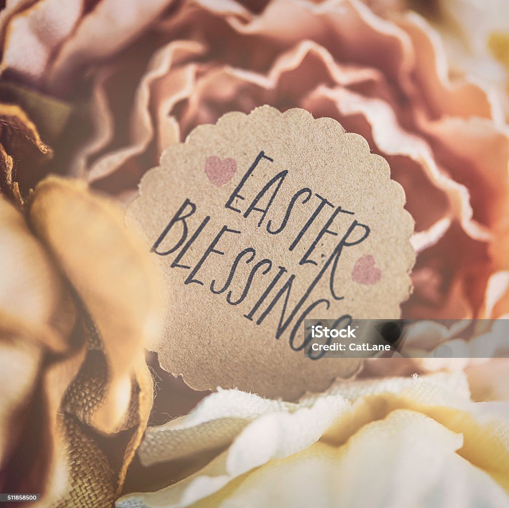 Easter Blessings message amidst fabric flowers Easter Stock Photo