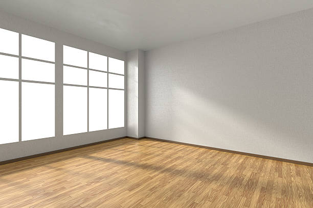 istock Empty room with parquet floor, textured white walls and window 511859354
