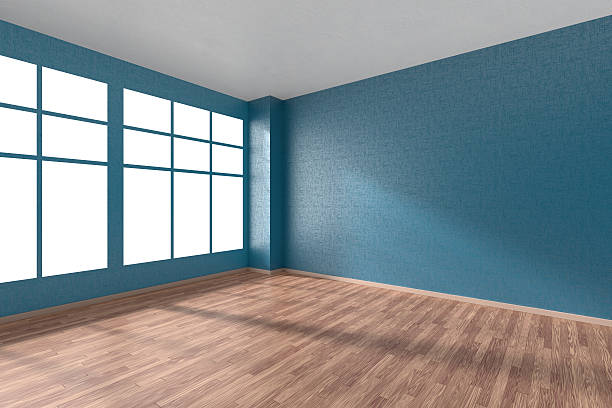 istock Empty room with parquet floor, textured blue walls and window 511859424