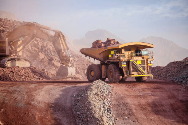 Mining Loading of copper ore on very big dump-body truck copper mining stock pictures, royalty-free photos & images