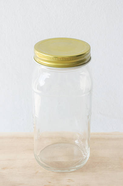 istock Glass jar with metal lid on wooden table 511864008