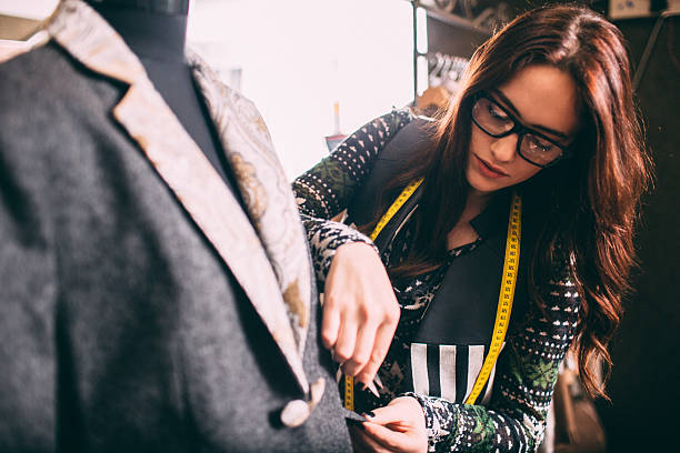 Designer A portrait of a designer in a store woman tailor stock pictures, royalty-free photos & images